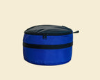 Ruby Moons packing round in blue, front view, shown on a light beige background