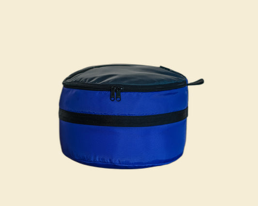Ruby Moons packing round in blue, front view, shown on a light beige background