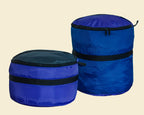 Ruby Moons packing rounds in two sizes, blue, shown side by side on a light beige background